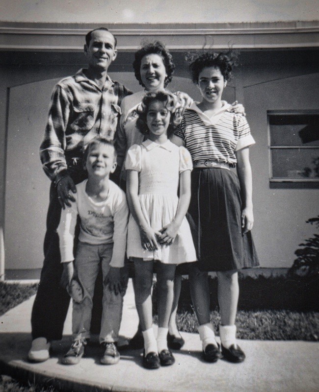  Notice my dad, (we called him Papi) restraining me for the picture. I was diagnosed later with ADHD :-) government. (oh, and that is our dog, Coffee) 